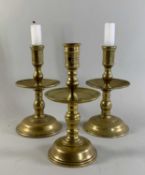 DUTCH BRASS HEEMSKERK CANDLESTICK with a pierced socket and a turned stem, central dished drip-