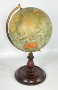 PHILIP'S 9-INCH TERRESTRIAL GLOBE, mounted on brass meridian half circle, on turned wooden base,