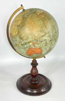 PHILIP'S 9-INCH TERRESTRIAL GLOBE, mounted on brass meridian half circle, on turned wooden base,