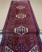 HAMADAN RUNNER, ivory hexagonal medallions, stylised floral madder field, ivory floral spandrels,