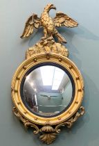 REGENCY STYLE CONVEX MIRROR, giltwood and gesso, moulded frame with ball decoration, spread eagle