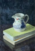 ‡ GRAHAM JONES oil on board - entitled verso, 'Gaudy Welsh Jug & Books', signed verso, 28 x 19cms