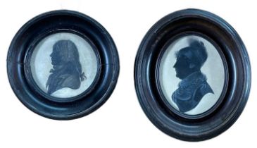 TWO EARLY 19TH CENTURY SILHOUETTES, on card, of George Hawks (1766-1820), 6.2cms diam, and his wife,