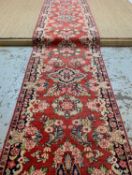 STYLISH MAHAL RUNNER, floral sprays and cusped medallions on a maddder field, narrow floret