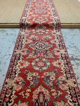 STYLISH MAHAL RUNNER, floral sprays and cusped medallions on a maddder field, narrow floret