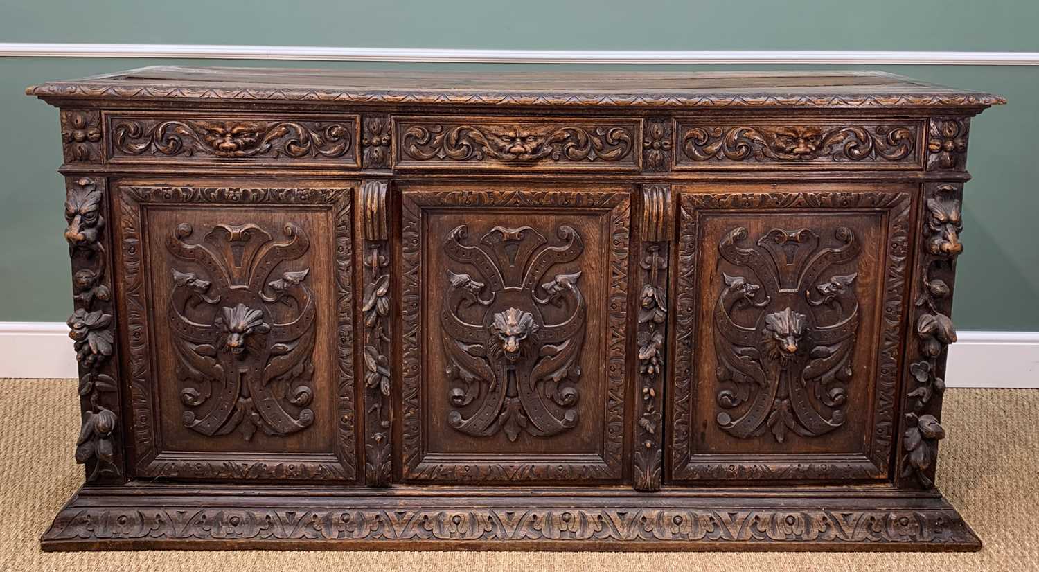 FLEMISH RENNAISSANCE-STYLE CARVED OAK SIDEBOARD, c.1900, three frieze drawers with carved 'Green