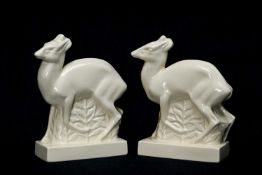 JOHN SKEAPING FOR WEDGWOOD: two stylised duiker deer sculptures, cream glaze, printed marks, 21cms h