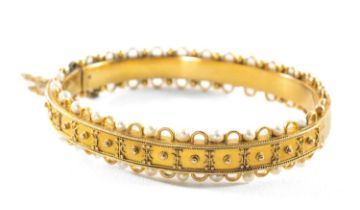 VICTORIAN YELLOW GOLD SEED PEARL HINGED BANGLE, 13.1gms in vintage Mallory & Son of Bath jewellery