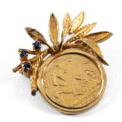 LATE VICTORIAN GOLD HALF SOVEREIGN, 1900, veiled head, mounted in yellow metal foliate brooch