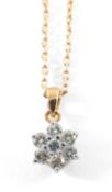18CT GOLD SEVEN STONE DIAMOND FLOWERHEAD PENDANT, 0.5cts overall approx., on 18ct gold chain, 4.ogms