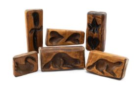 SIX CANADIAN CEDAR DAIRY MOULDS, carved and scorched with various motifs incl. beaver, hearts, bowie