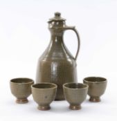 GEOFFREY WHITING (1919-1988) Avoncroft pottery mead jug, 26cms high, and four cups in olive green,