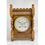 EARLY 20TH CENTURY WALNUT 8-DAY MANTEL CLOCK, the William Morris-style enamelled dial within cast