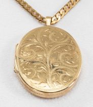 9CT GOLD OVAL LOCKET, scroll engraved on 9ct gold flat curb link chain, 75cms long, 36.5gms, in