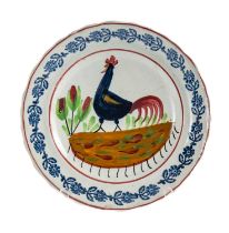 LLANELLY POTTERY COCKEREL PLATE, sponged floral sprig border centred with stylised cockerel,