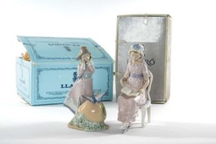 TWO LLADRO FIGURES, including, 'Land of Giants', 5716, 23cms h, and 'A Good Book', 5084, 24cms h (2)