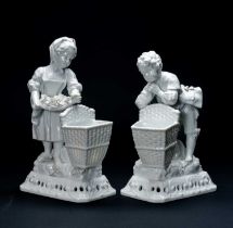PAIR OF GERMAN WHITE PORCELAIN FIGURAL BASKETS, incised numbers to bases '429' and crossed swords,