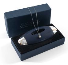 MILLENIUM DIAMOND PENDANT ON 10K WHITE GOLD CHAIN, the single round brilliant cut stone measuring