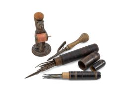 TREEN COLLECTABLES comprising Black Forest carved bear pin cushion, 2 x sailmakers needle cases