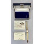 TISSOT 9CT GOLD LADY'S WRISTWATCH, with integral bark effect bracelet and original box, the round