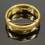 22CT GOLD WIDE WEDDING BAND, attached 9ct gold size reducer, the ring with Birmingham date mark