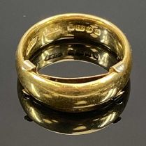 22CT GOLD WIDE WEDDING BAND, attached 9ct gold size reducer, the ring with Birmingham date mark