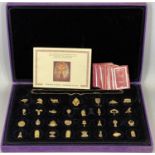 THE MYSTICAL TUTANKHAMUN CHARM COLLECTION BY MAYFAIR EDITION, 31 gold plated silver charms with