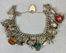 SILVER CHARM BRACELET WITH PADLOCK CLASP HOLDING 22 SILVER / WHITE METAL CHARMS including animals,