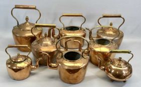 EIGHT VICTORIAN COPPER KETTLES, 3 x circular with acorn finials, 33.5cms H (the tallest), 2 x