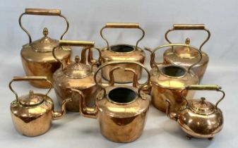 EIGHT VICTORIAN COPPER KETTLES, 3 x circular with acorn finials, 33.5cms H (the tallest), 2 x