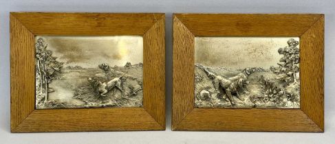 PAIR OF RECTANGULAR PLATED METAL PLAQUES, decorated in high relief with pointer dogs and game, in