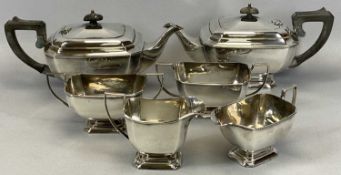 TWO SIMILAR ART DECO STYLE THREE-PIECE EPNS TEA SETS, each comprising teapot, 30cms across, milk jug