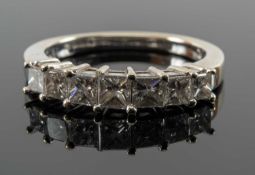 18CT WHITE GOLD SEVEN STONE DIAMOND RING, the graduating princess cut stones measuring 1.0cts