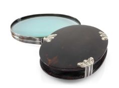 GEORGE III TORTOISESHELL POCKET LENS, with reeded white metal mounts, oval 10.2cm wide Provenance:
