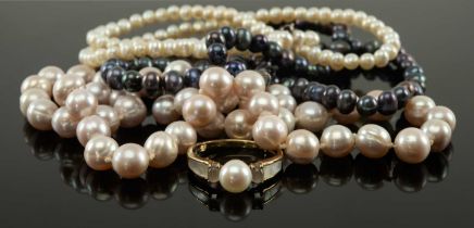 THREE SINGLE STRAND CULTURED PEARL NECKLACES, comprising strand of black pearls 4mm/5mm diam, a