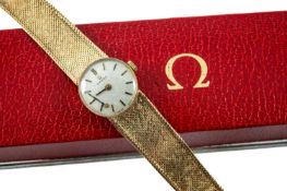 9CT GOLD OMEGA LADY'S WRISTWATCH, the silvered small circular dial with baton hour markers, with