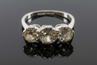 THREE-STONE DIAMOND RING, shank stamped '18CT PLAT', tot diamond wt. approx. 1.75ct, gross wt