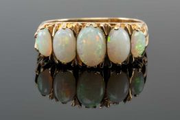 9CT GOLD FIVE STONE OPAL RING, having five graduated oval opals, ring size O, 3.4gms Provenance: