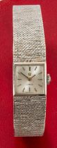 9CT WHITE GOLD OMEGA LADY'S WRISTWATCH, the inside back cover numbered 7115698, integrated 9ct white