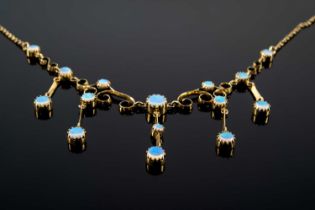 9CT GOLD OPAL DROP NECKLACE, 40cms long, set with fifteen opals, 6.2gms Provenance: private