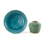 SULTANABAD WARE POTTERY DISH, of shallow rounded form on a short foot, turquoise glaze with stylised