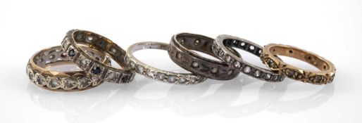 ASSORTED DRESS RINGS comprising 9ct white gold half eternity ring, white metal eternity ring, 9ct