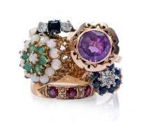 FIVE DRESS RINGS, comprising sapphire flower cluster ring, three stone diamond and sapphire ring,