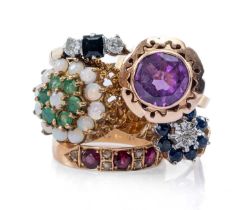 FIVE DRESS RINGS, comprising sapphire flower cluster ring, three stone diamond and sapphire ring,