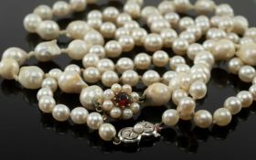 TWO SINGLE STRAND PEARL NECKLACES, comprising necklace of graduated pearls from 9-5mm, clasp stamped