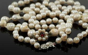 TWO SINGLE STRAND PEARL NECKLACES, comprising necklace of graduated pearls from 9-5mm, clasp stamped