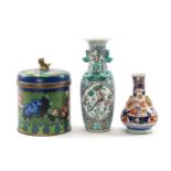 THREE ORIENTAL ORNAMENTS, comprising Chinese Champlevé enamel jar and cover, with gilt dog of fo