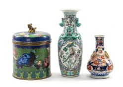 THREE ORIENTAL ORNAMENTS, comprising Chinese Champlevé enamel jar and cover, with gilt dog of fo