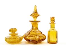 THREE 19TH C. AMBER GLASS SCENT BOTTLES, including Bohemian bottle with gilt foliate decoration