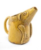 AN EWENNY SLIPWARE POTTERY ZOOMORPHIC JUG in the form of a pig, mustard ground, Welsh inscribed 'Y